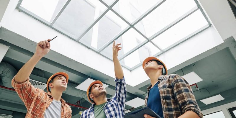 engineers-discussing-old-massive-roof-window-1.jpg